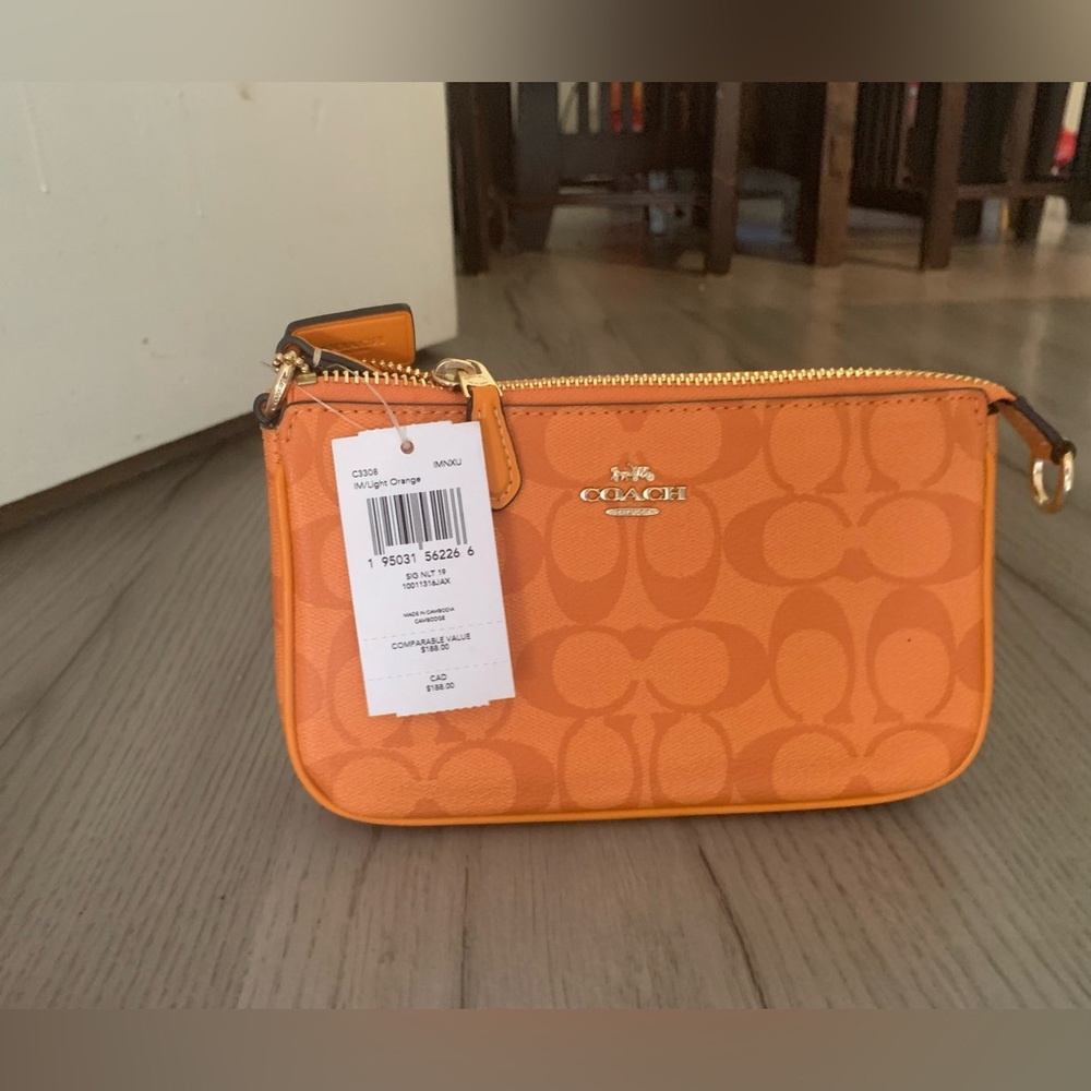 Coach nolita 19 signature orange print.